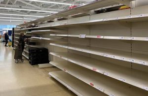 Empty supermarket shelves - Photo by John Cameron on Unsplash